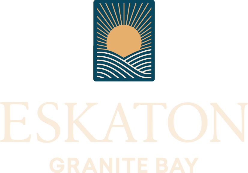 Logo with a stylized sun rising over wavy lines, above the large, light-colored text ESKATON and smaller text GRANITE BAY below it. The background is light gray.