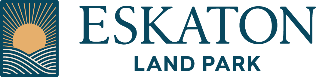 Eskaton Land Park logo featuring a stylized sun rising over wavy lines, with the words ESKATON LAND PARK in bold, blue uppercase letters to the right of the graphic.