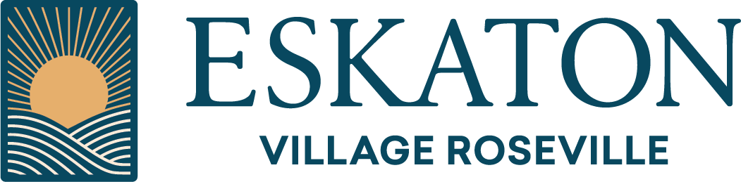 Logo for Eskaton Village Roseville. On the left, a square icon shows a stylized sun rising over curved lines representing hills or fields. To the right, the text reads ESKATON VILLAGE ROSEVILLE.